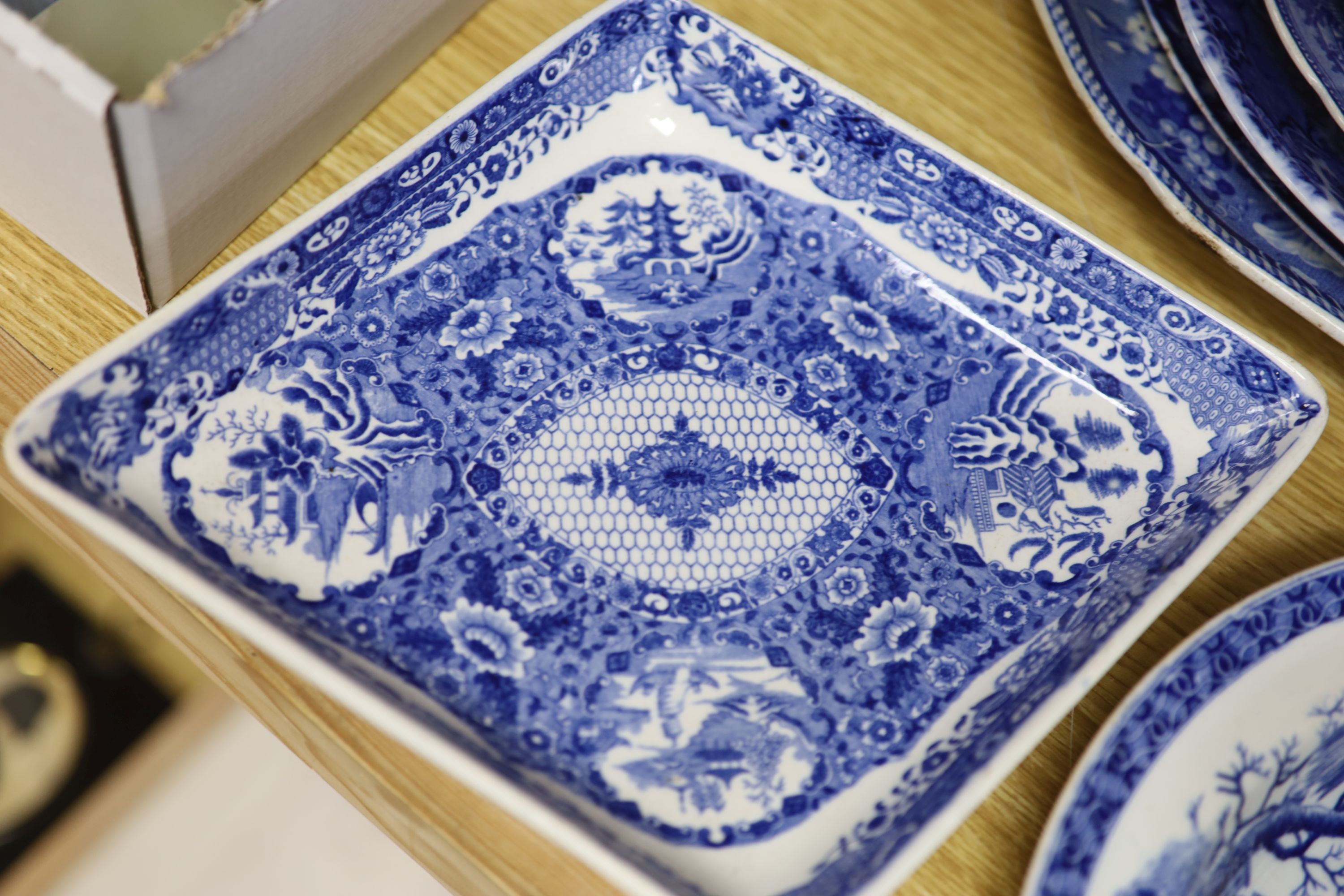 A quantity of 19th century blue and white pottery, including a Harewood House platter, 37cm, and a Spode Rome Tiber soup plate